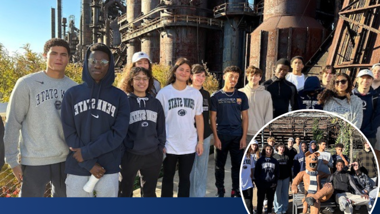 students wearing Penn State shirts smile while standing in front of Bethlehem SteelStacks